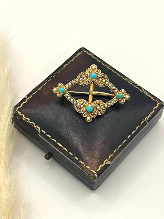 A yellow gold turquoise and pearl buckle style brooch