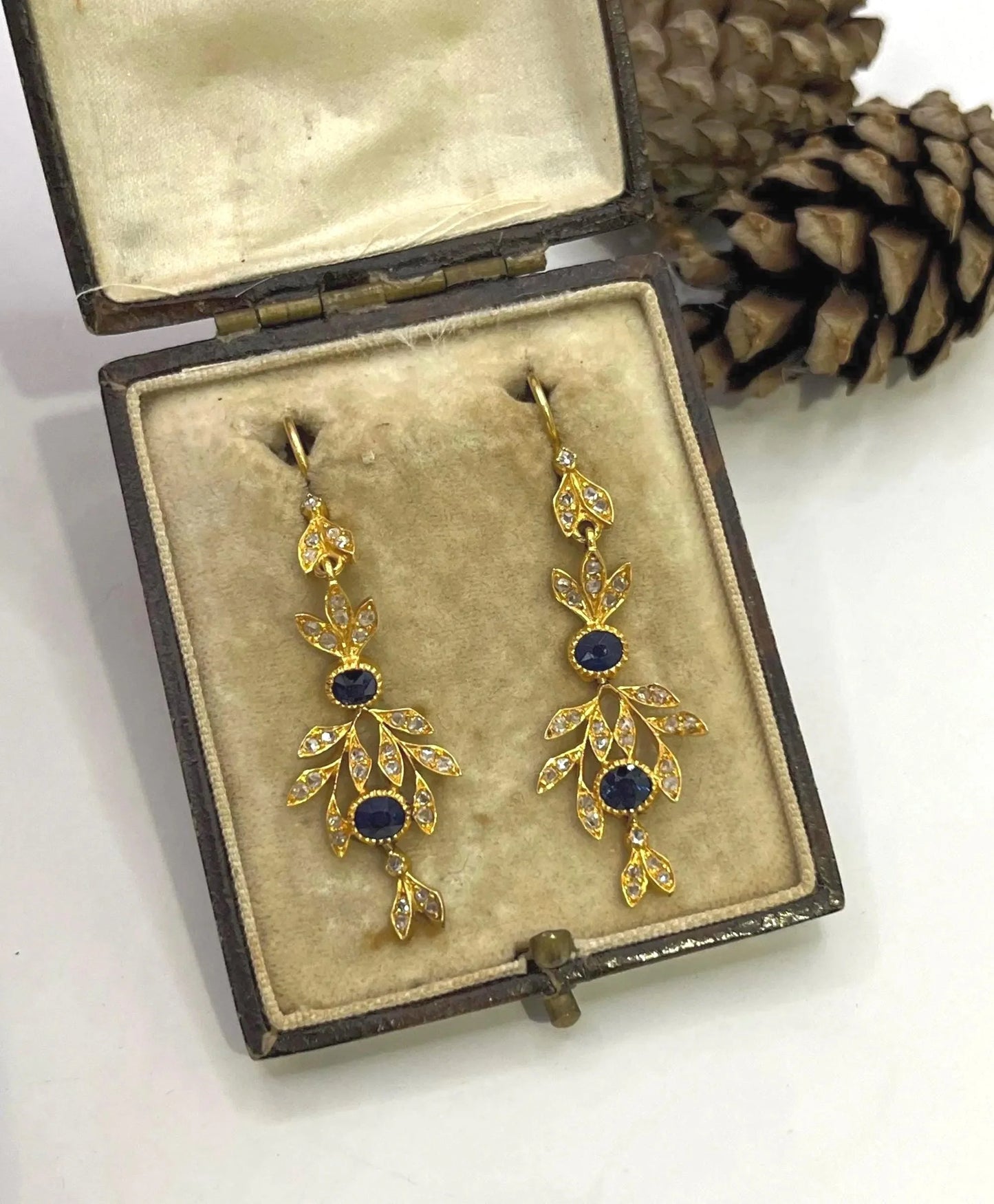 A pair of sapphire and diamond foliate drop earrings in yellow gold, in an antique box