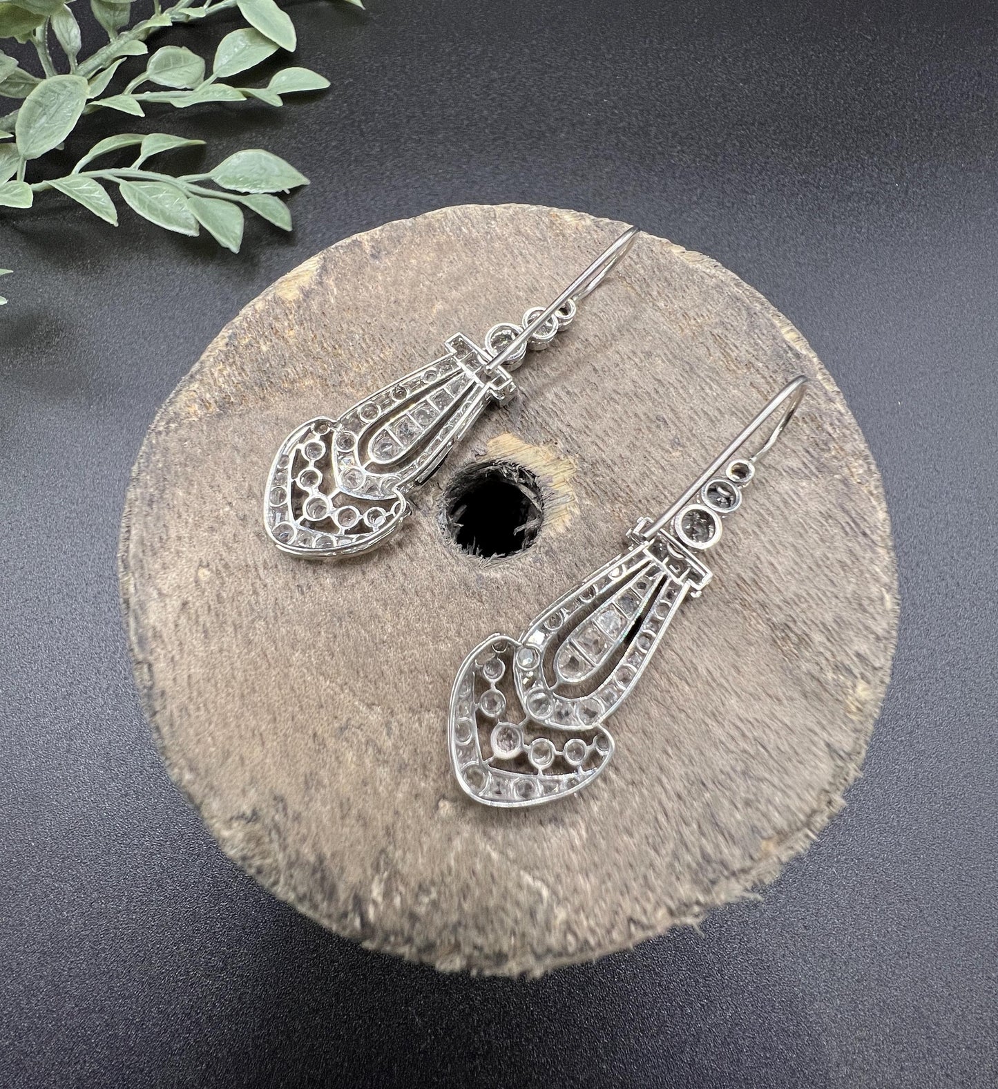 A pair of antique platinum diamond drop earrings