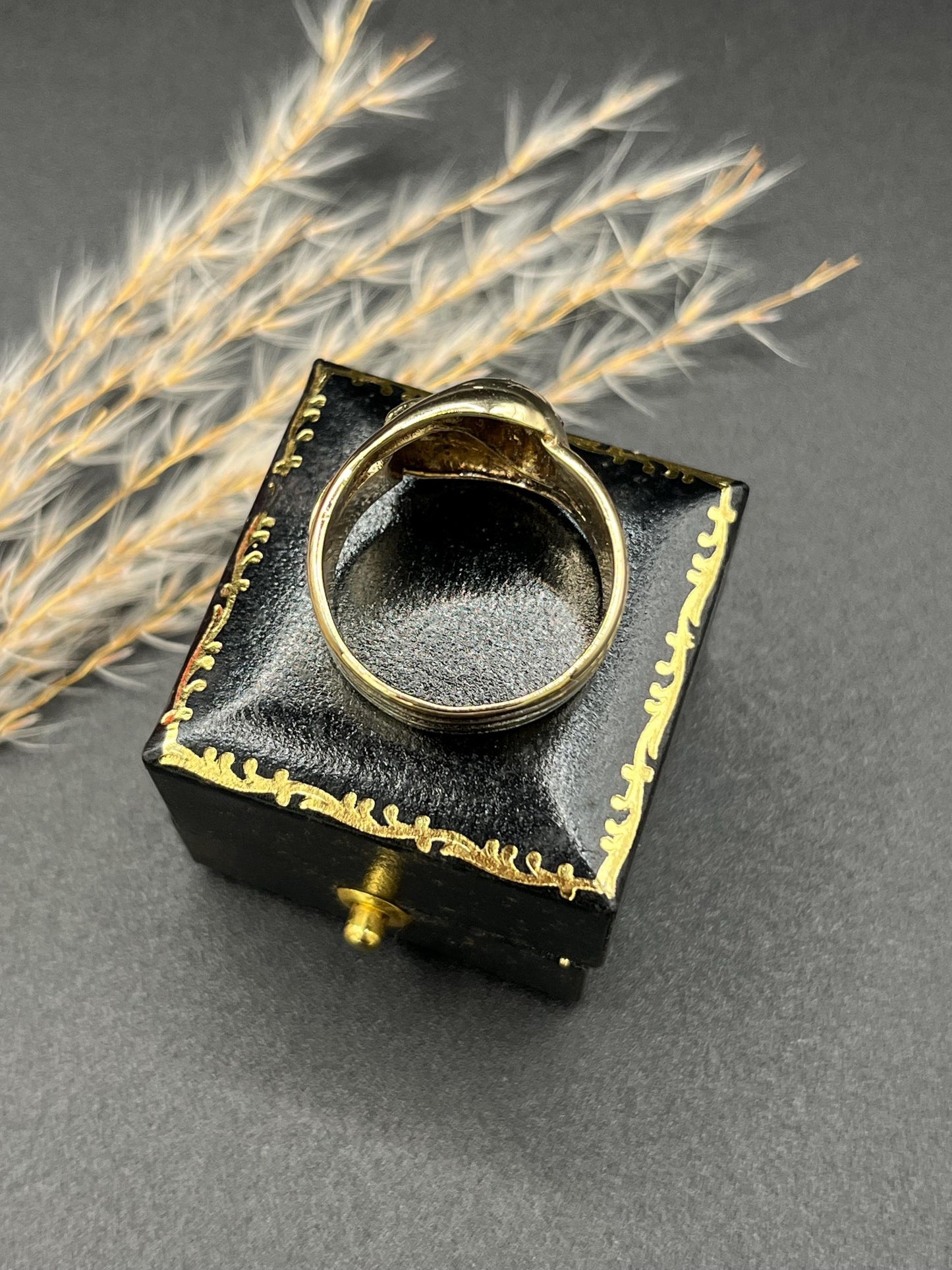 A yellow gold ruby and diamond set double headed snake ring
