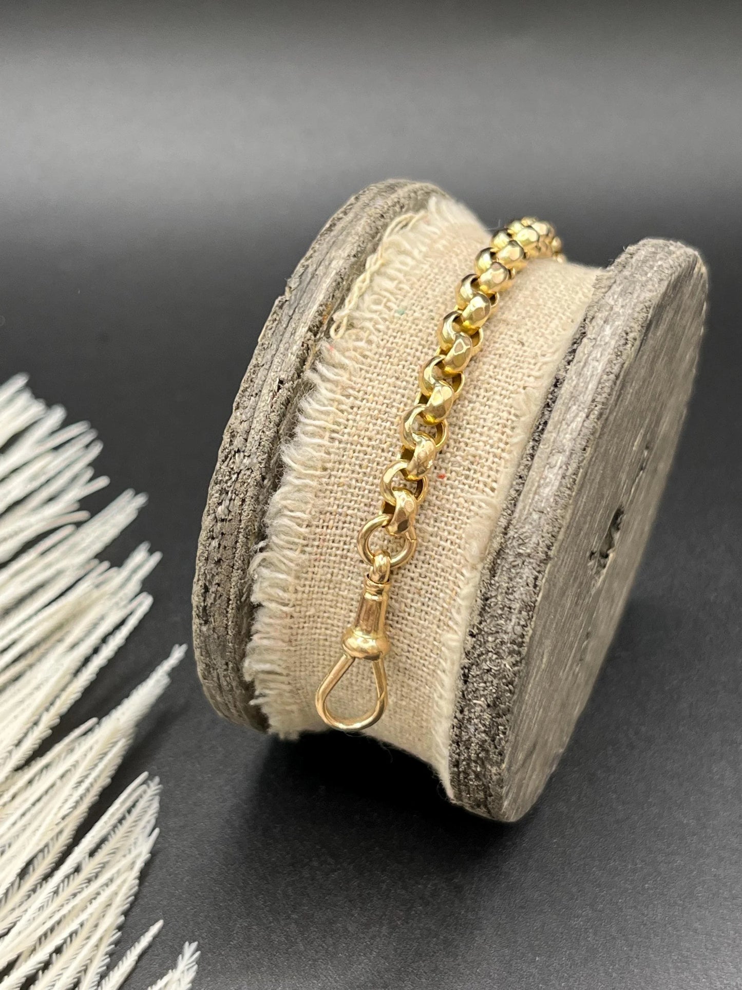 A yellow gold round link bracelet with a lobster claw clasp