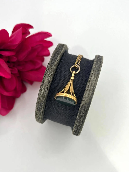 A yellow gold fob pendant with a bloodstone base, with a gold chain
