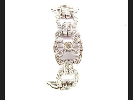Extraordinarily exquisite and striking Diamond bracelet in the Art Deco style.Total Diamond weight 10.21 carats, alternating links expressing a five-point star design, Set in 18ct white gold