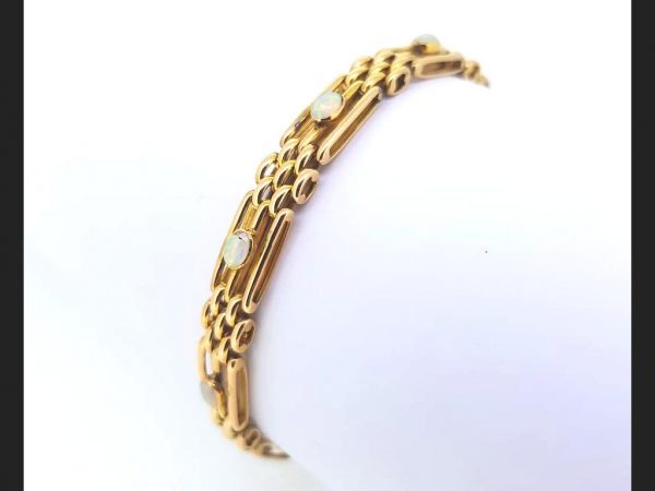 Victorian gate bracelet, each link set with an opal, 15ct yellow gold