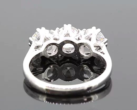 Classic Diamond Trilogy Ring, featuring three round brilliant-cut diamonds totaling 2.34 carats. Mounted in platinum. Diamond colour: G