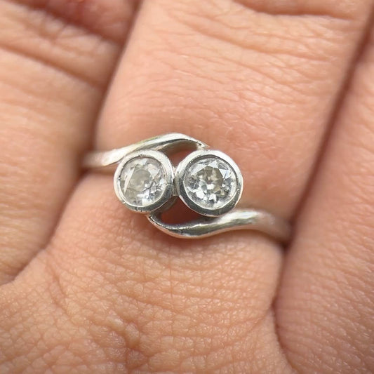 Edwardian Antique Diamond Toi et Moi Two Stone Crossover Engagement Ring in Platinum