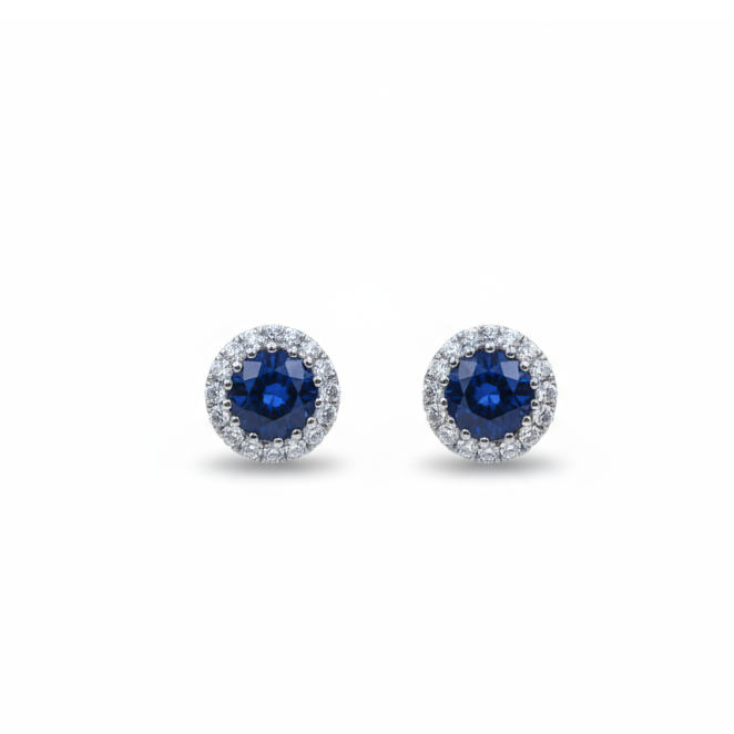 A pair of round cluster stud earrings in white gold with sapphires and diamonds