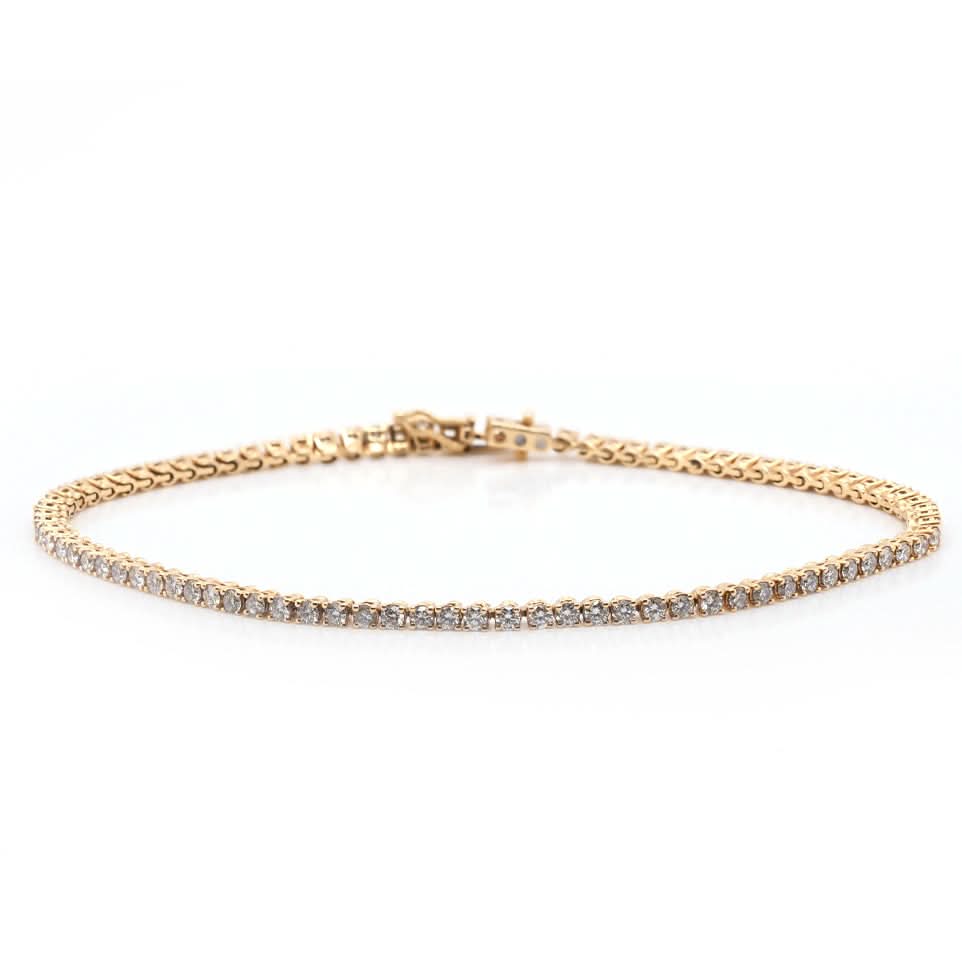 A yellow gold line bracelet set with brilliant cut diamonds