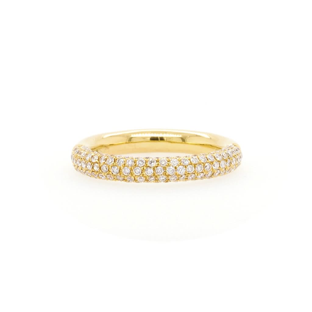 A yellow gold half eternity ring set with multiple rows of round diamonds