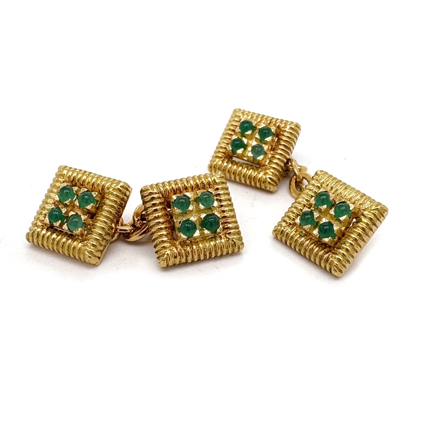 A pair of yellow gold square-shaped cufflinks with cabochon emeralds