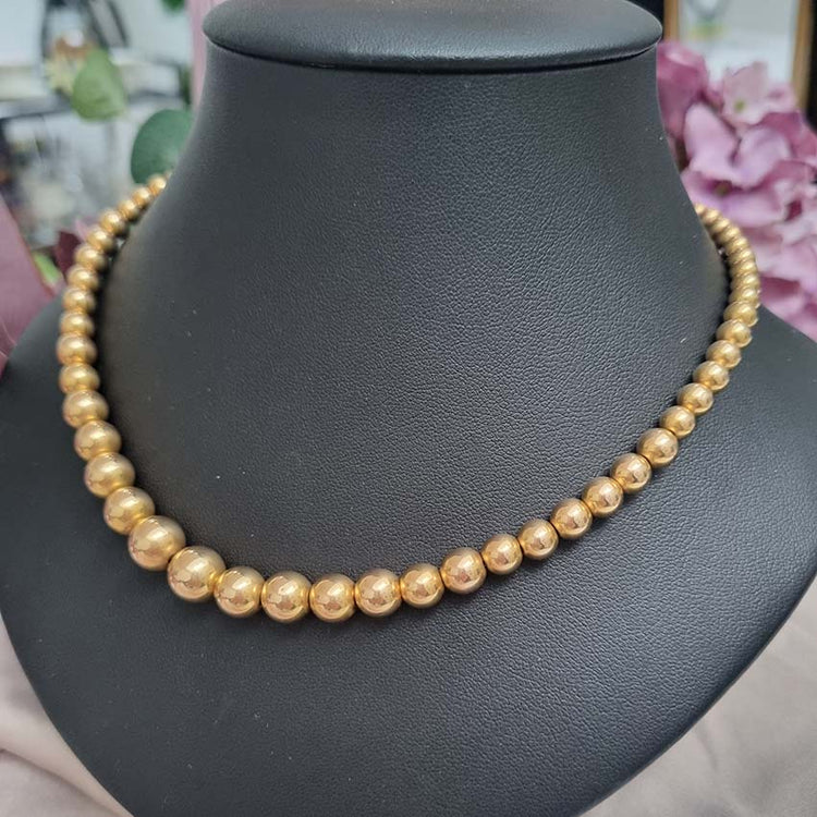 Vintage Graduating Yellow Gold Bead Necklace, underlying chain strung with polished 14ct yellow gold beads measuring from 9.5mm to 4.5mm. Circa 1930s