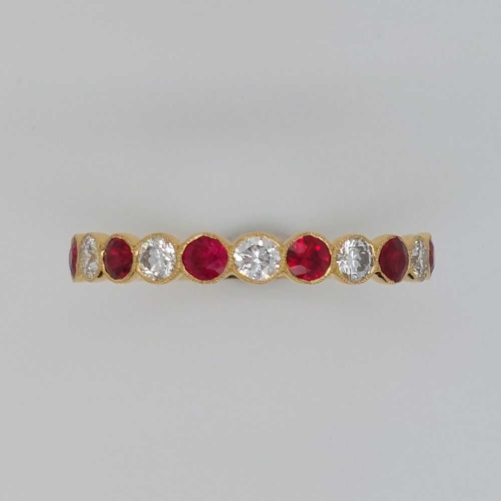 0.57ct Ruby and Diamond Millegrain Set Eternity Ring