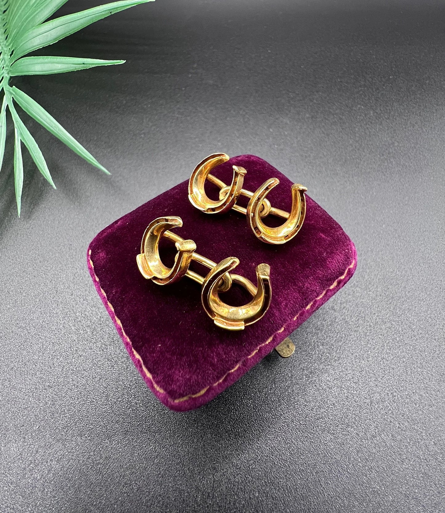 A pair of double-sided horseshoe cufflinks in yellow gold