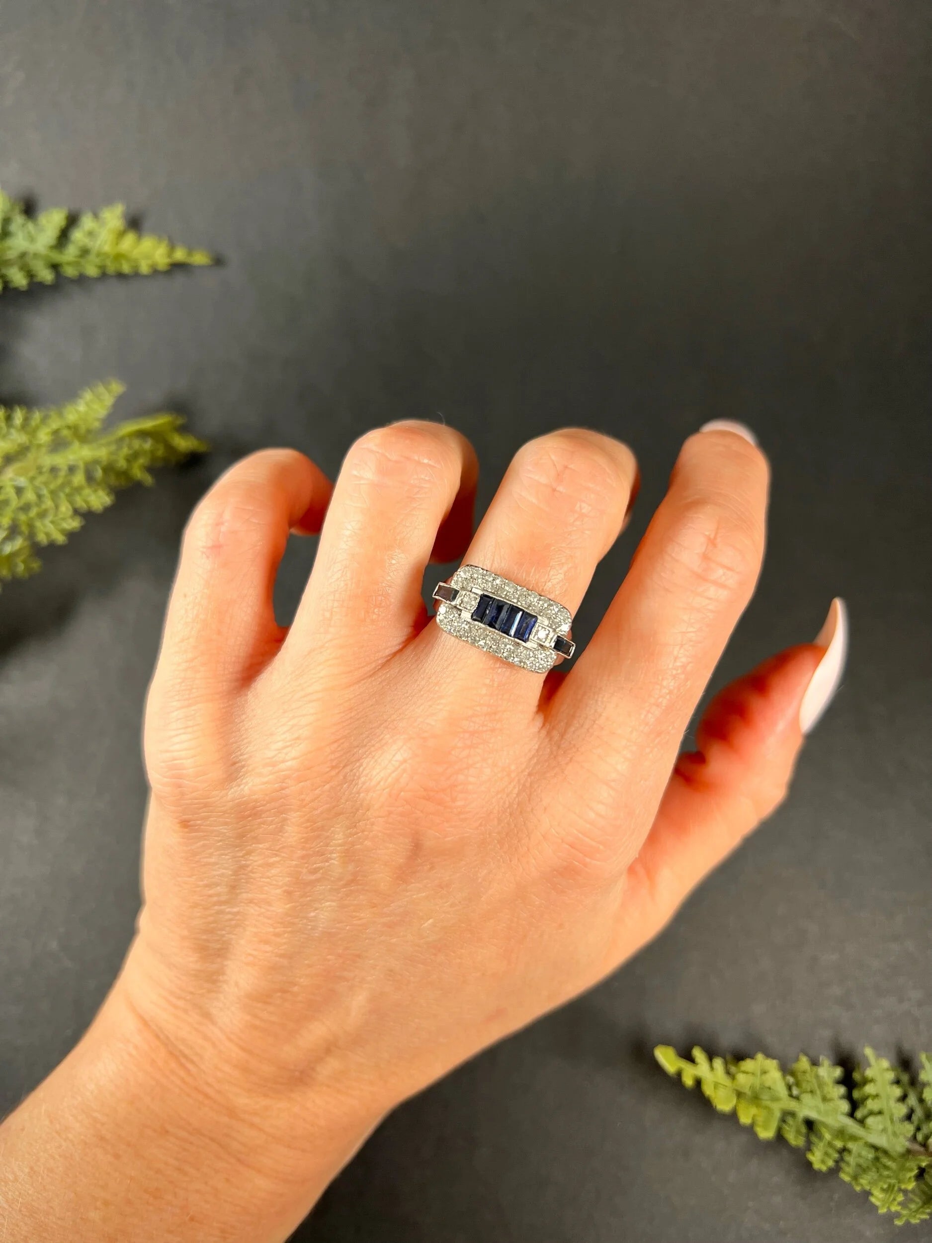 A sapphire and diamond cocktail ring in platinum, modelled on a hand