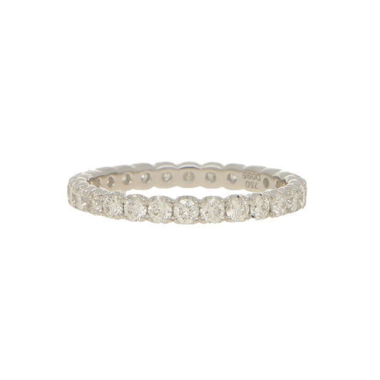 A brilliant cut diamond full eternity ring in white gold, stamped 750 D095, on a white background