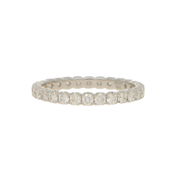 A brilliant cut diamond full eternity ring in white gold, stamped 750 D095, on a white background