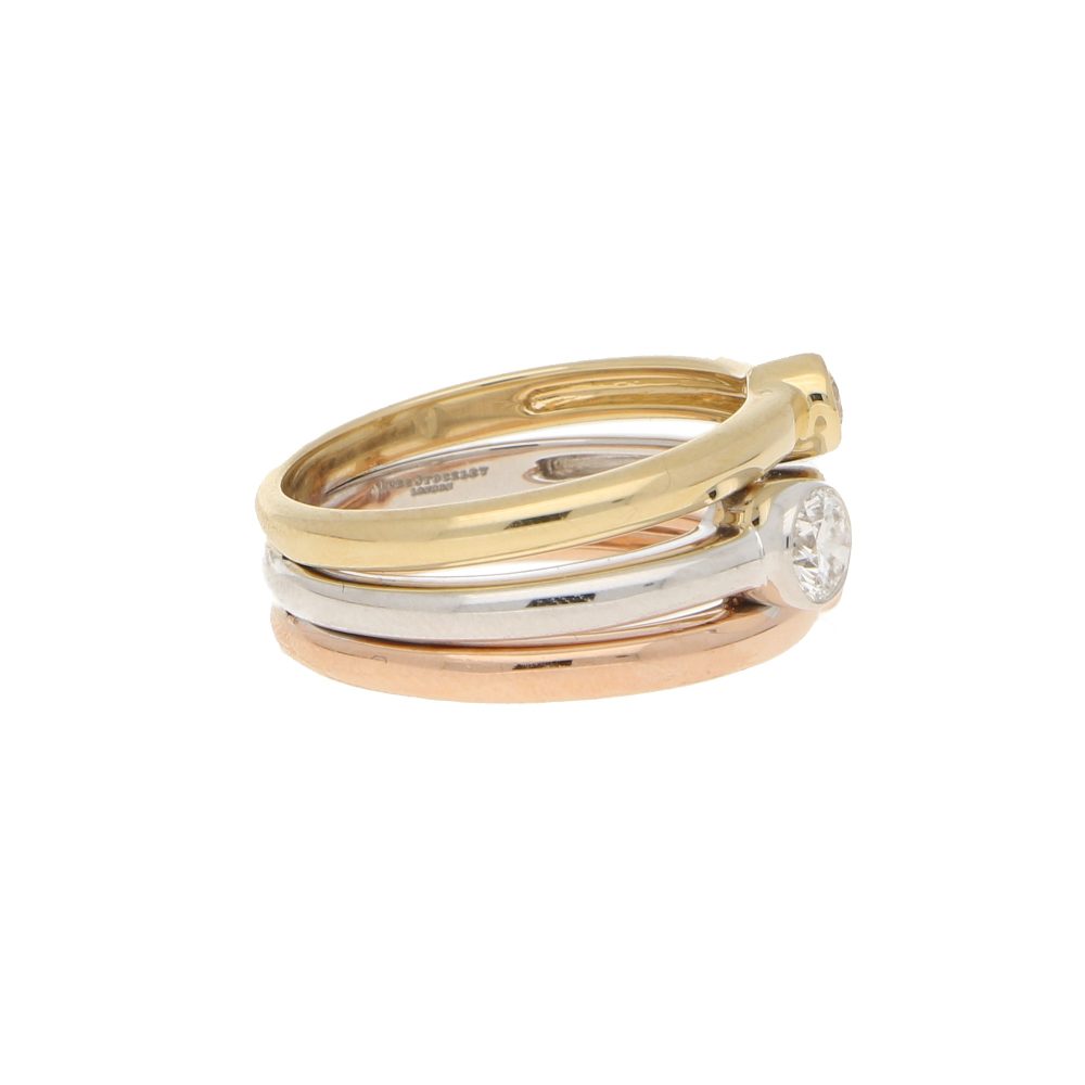 Diamond triple ring set in yellow, white and rose gold.