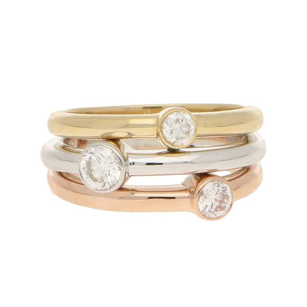 Diamond triple ring set in yellow, white and rose gold.