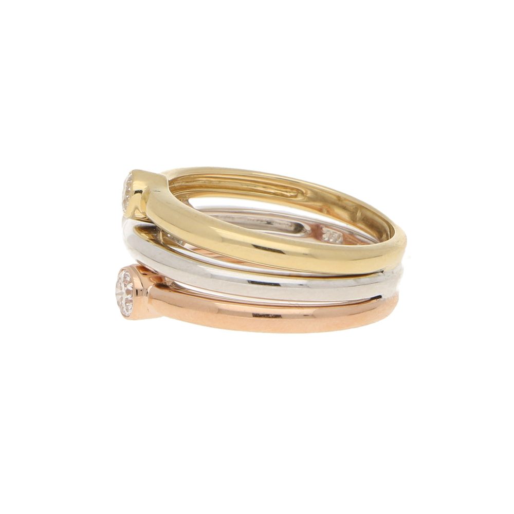 Diamond triple ring set in yellow, white and rose gold.