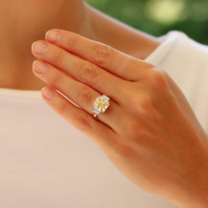 Natural 5.03 carat yellow diamond ring set in yellow gold and platinum.