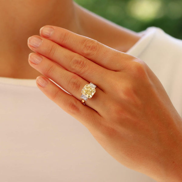 Natural 5.03 carat yellow diamond ring set in yellow gold and platinum.