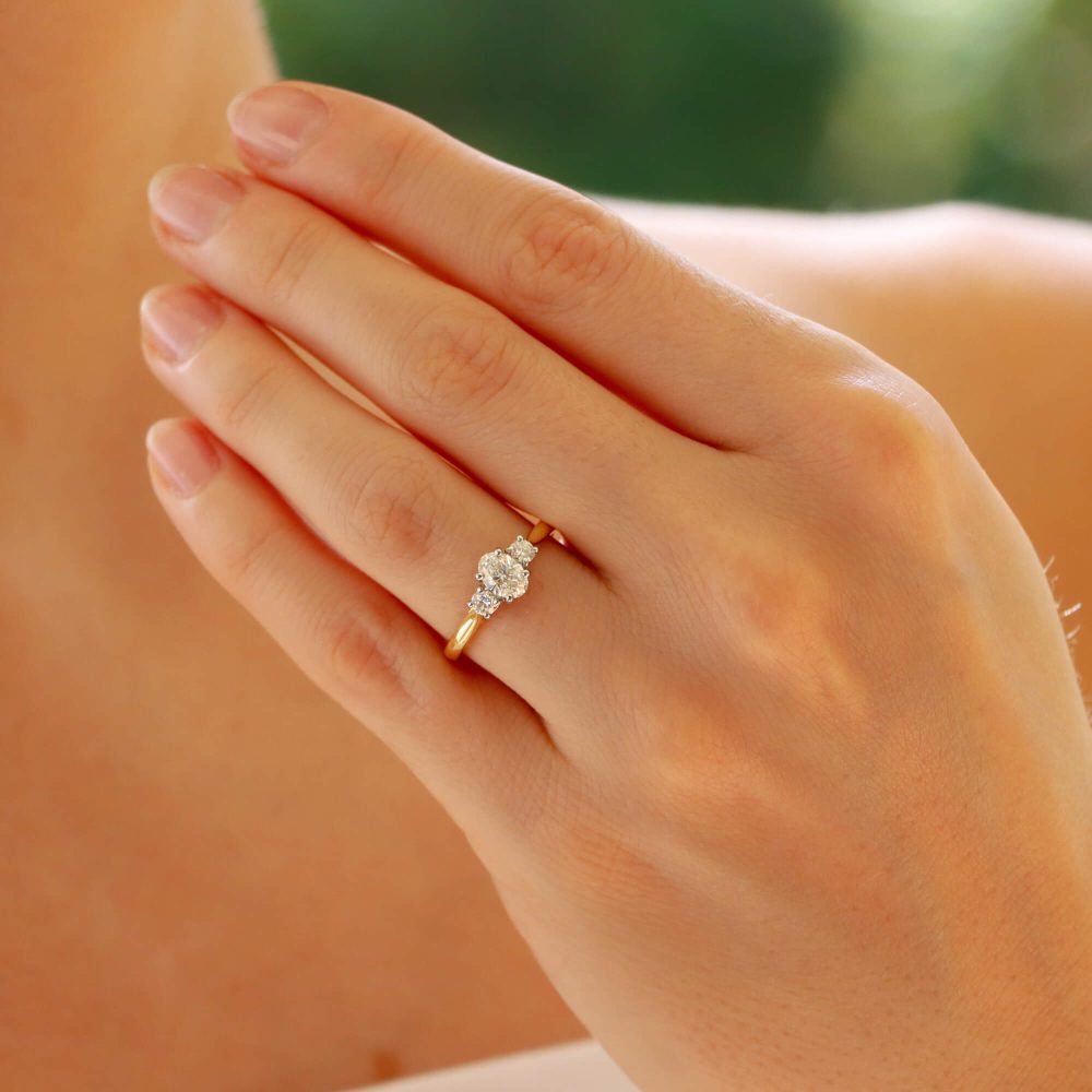 Diamond three stone ring in yellow gold and platinum.