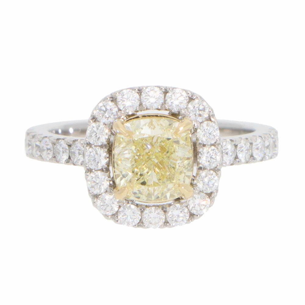 Yellow diamond cluster ring in platinum and yellow gold.