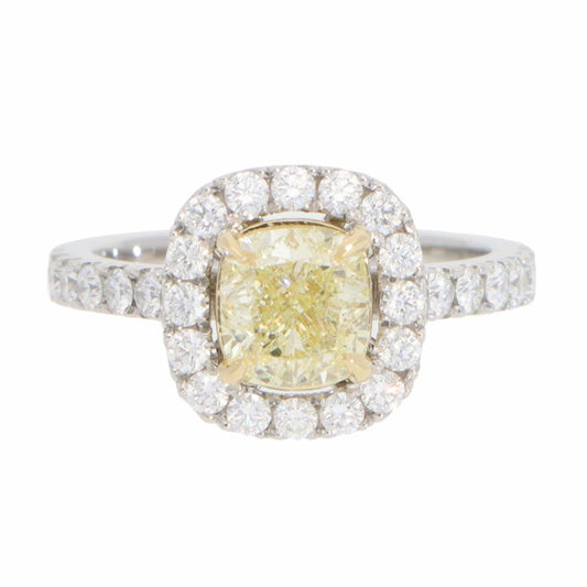 Yellow diamond cluster ring in platinum and yellow gold.