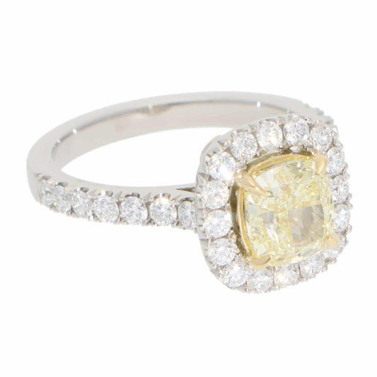 Yellow diamond cluster ring in platinum and yellow gold.