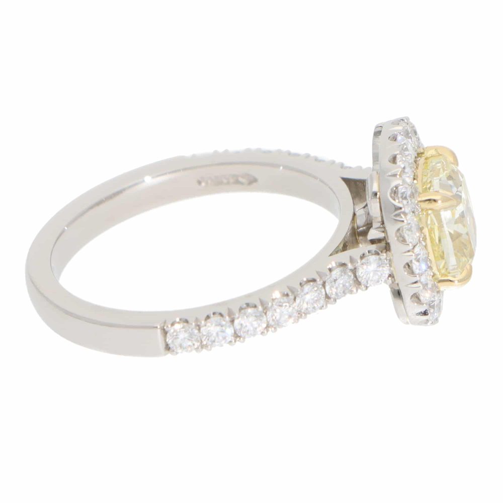 Yellow diamond cluster ring in platinum and yellow gold.