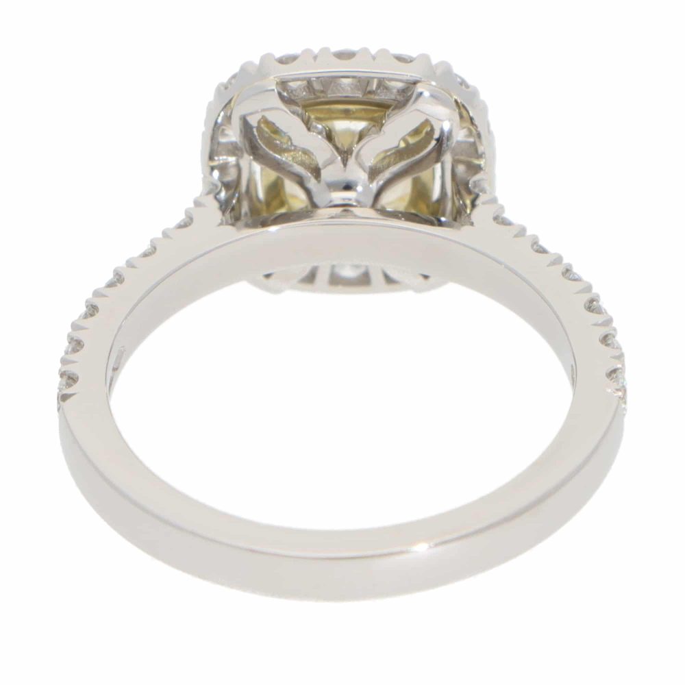 Yellow diamond cluster ring in platinum and yellow gold.