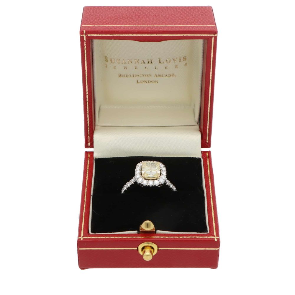 Yellow diamond cluster ring in platinum and yellow gold.