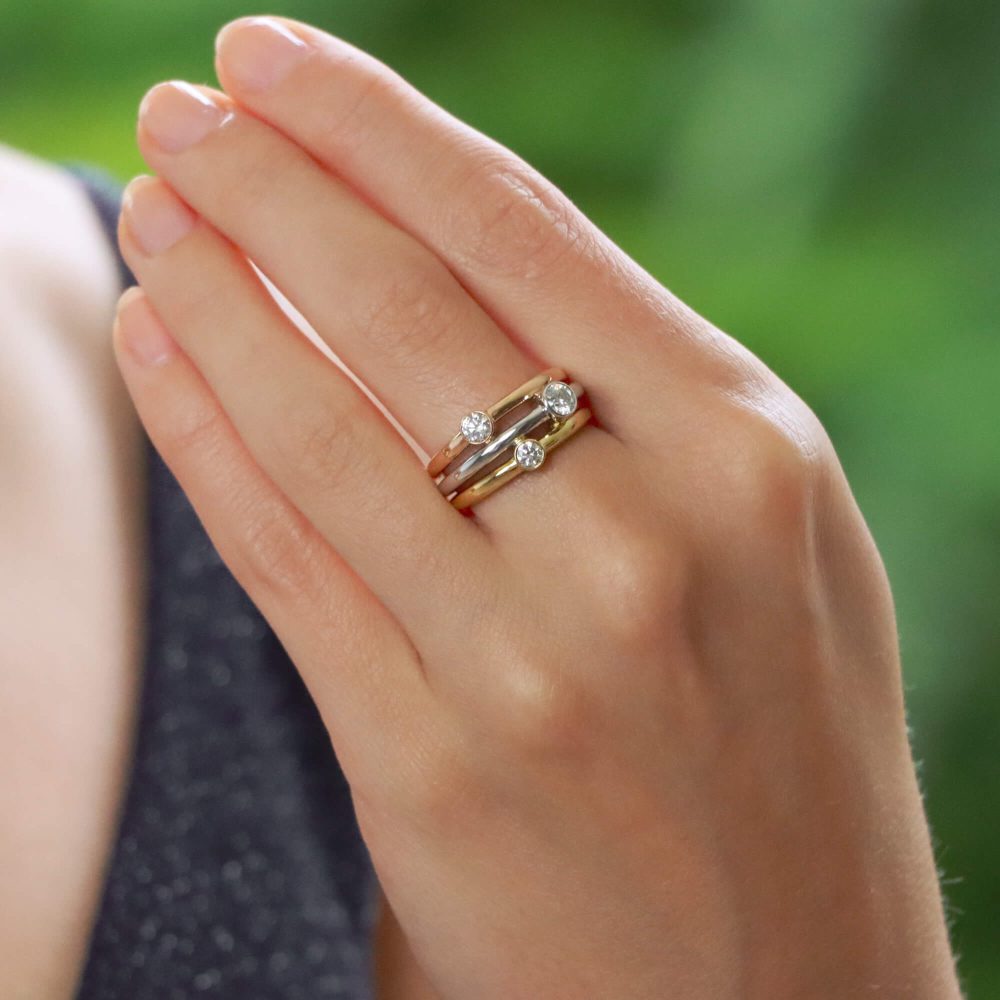 Diamond triple ring set in yellow, white and rose gold.