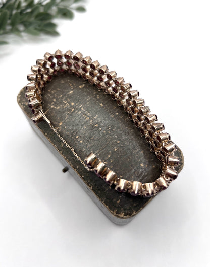 A triple row garnet bracelet in rose gold