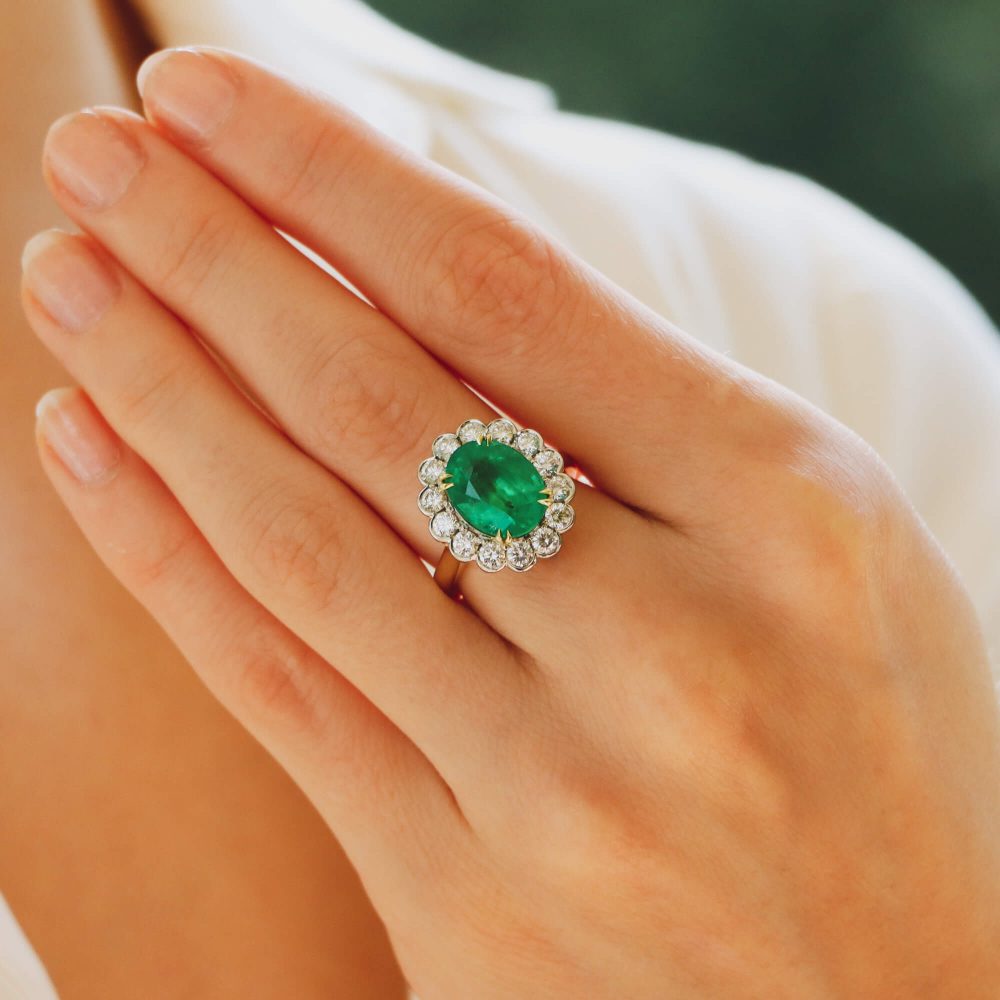 3.96ct Oval Cut Emerald and Diamond Cluster Ring