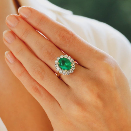3.96ct Oval Cut Emerald and Diamond Cluster Ring