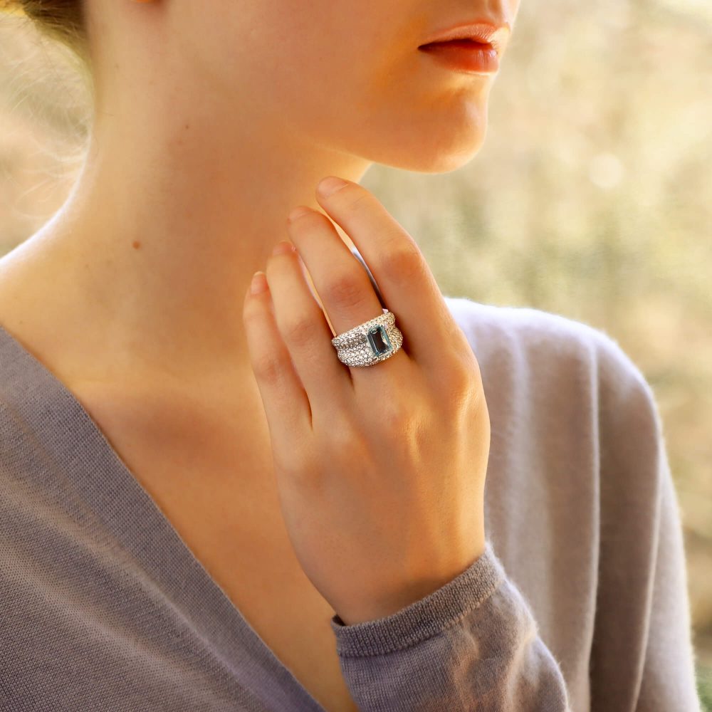 An incredibly sparkly 1.93ct emerald cut aquamarine and diamond bombe ring set in 18ct white gold.