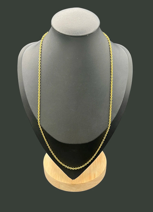 A yellow gold trace link chain necklace, on a black bust