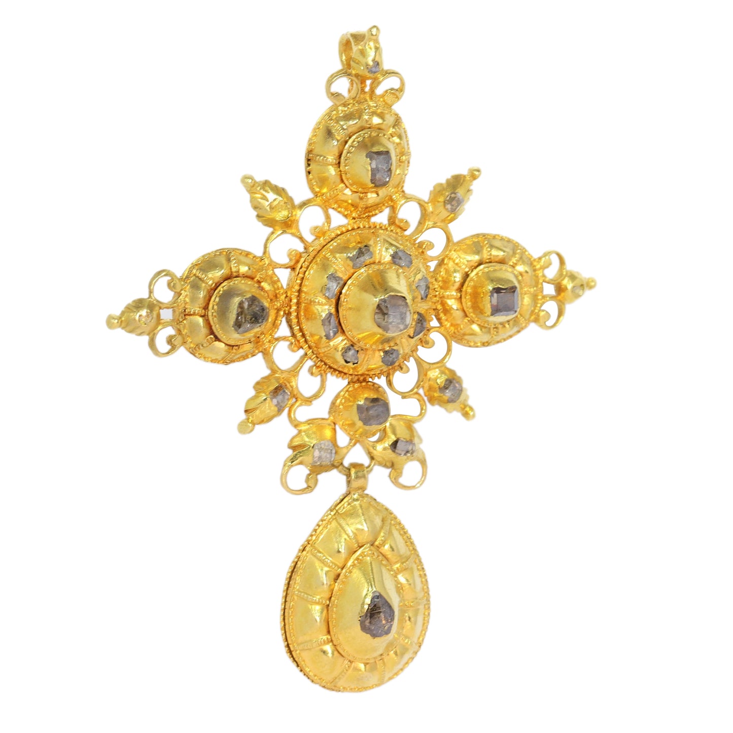 An ornate yellow gold cross pendant with table cut diamonds