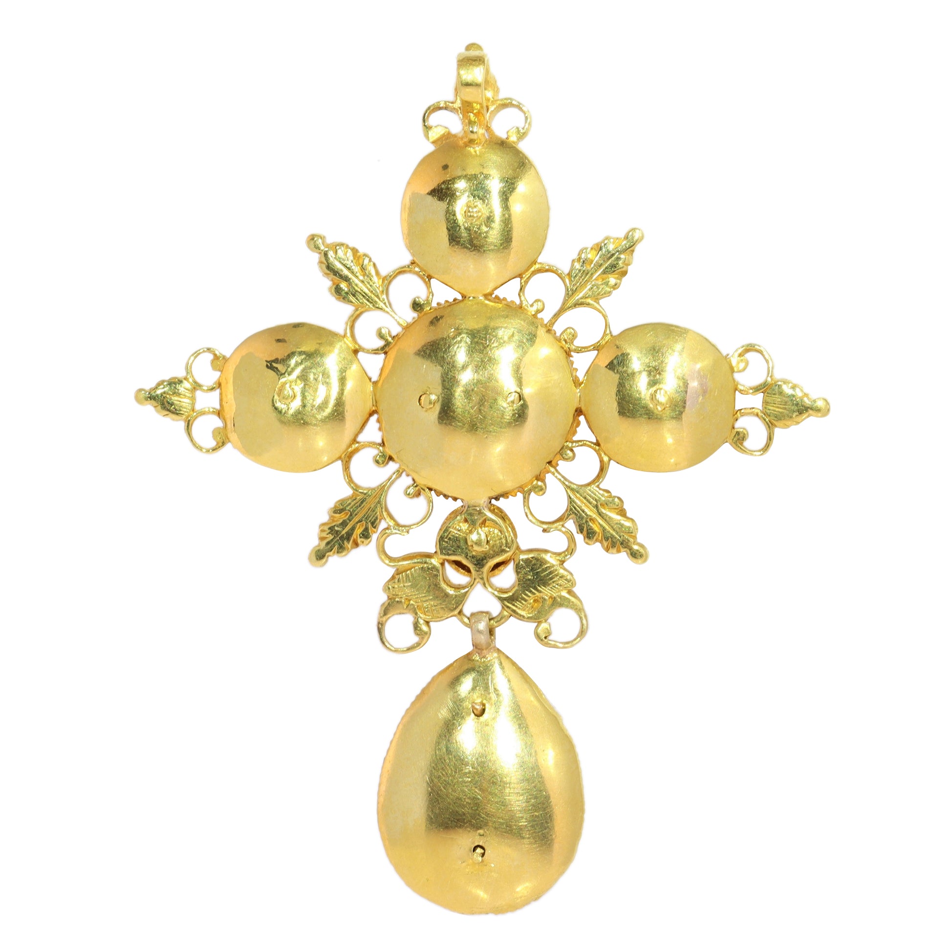 An ornate yellow gold cross pendant