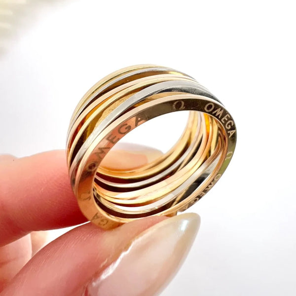18 Carat Three Colour Gold Ripple Omega Ladymatic Band Ring