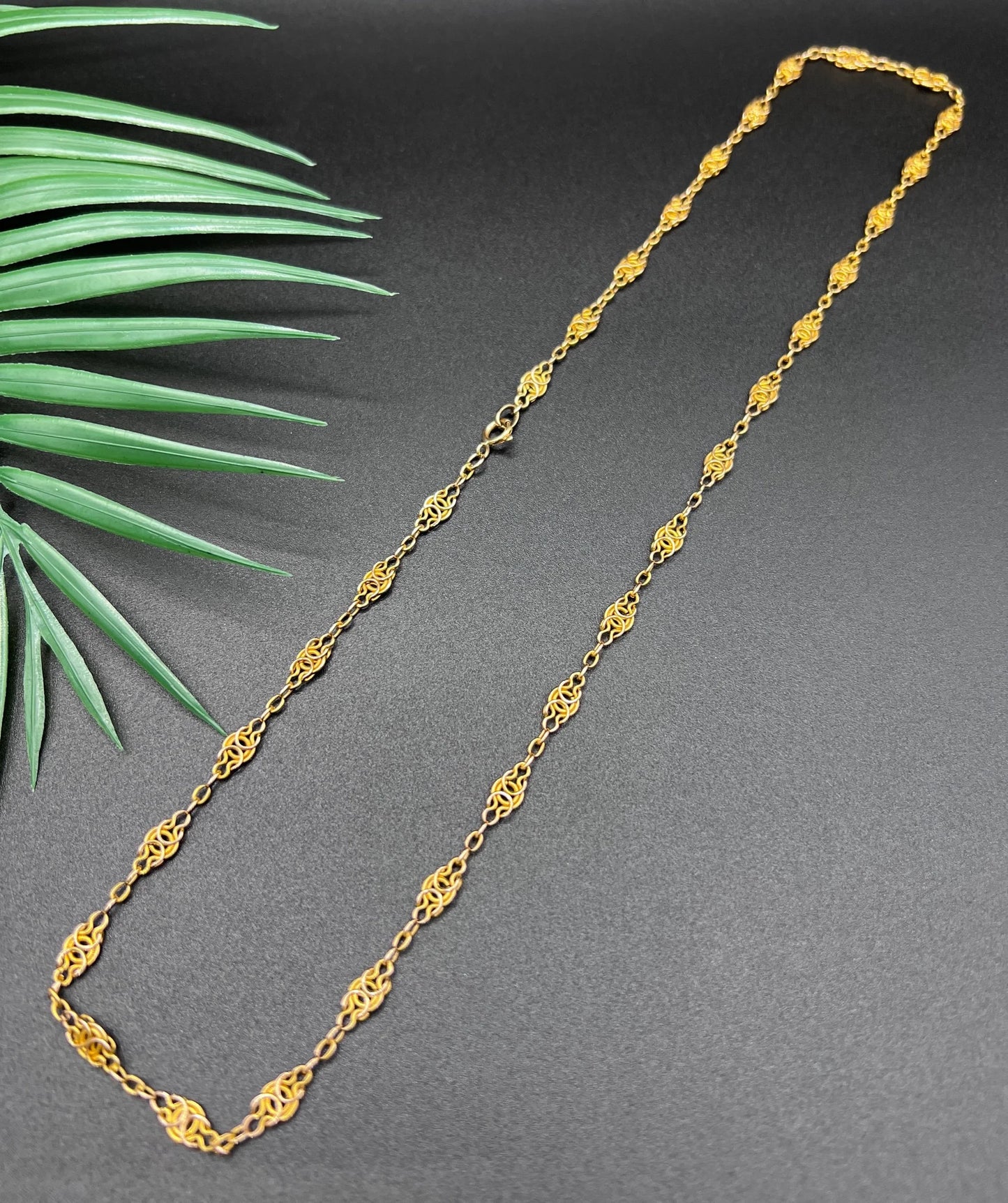 A yellow gold fancy link chain necklace