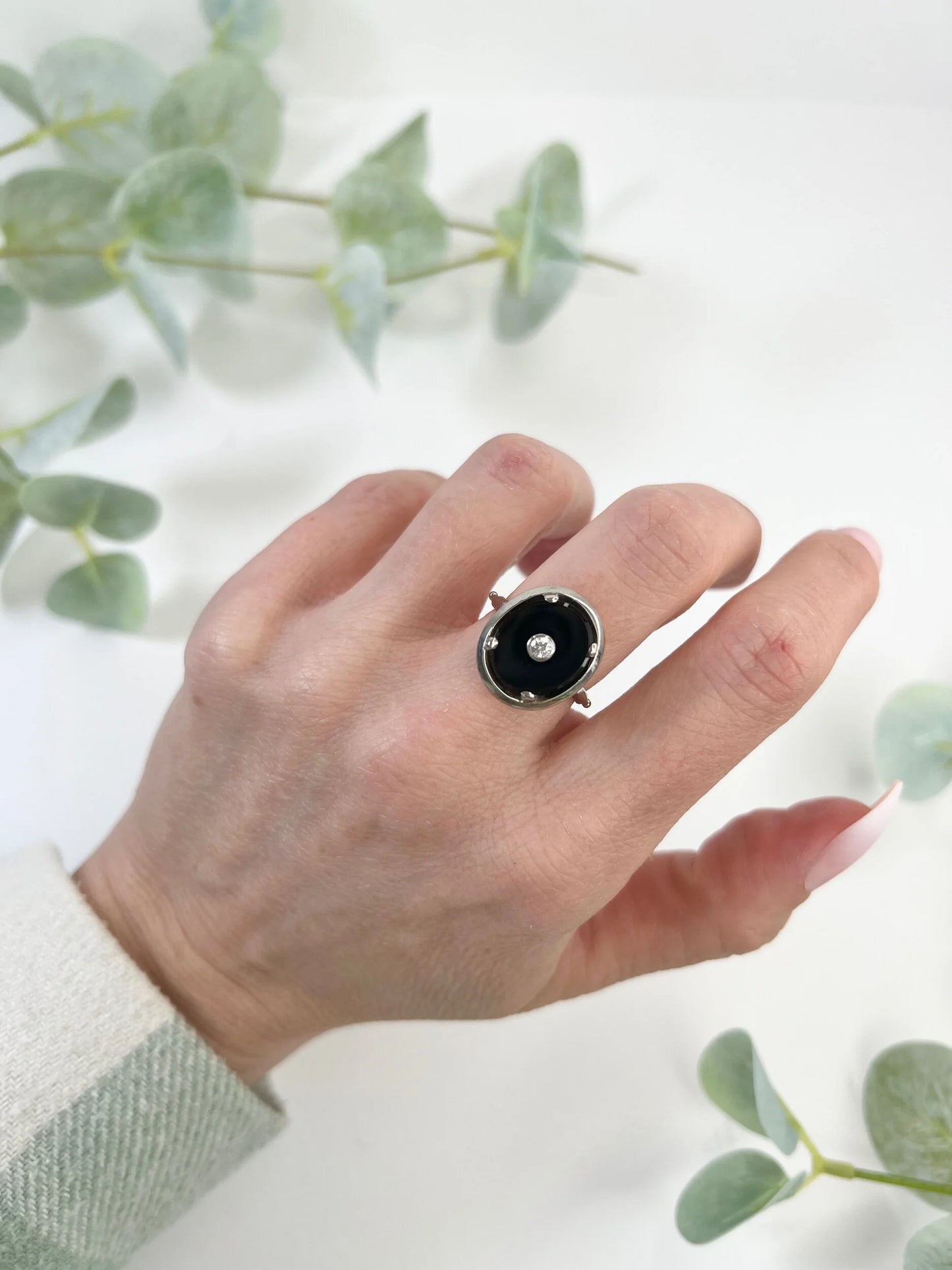 Art Deco 18 Carat Two Colour Gold Oval Onyx and Diamond Halo Ring, Circa 1920