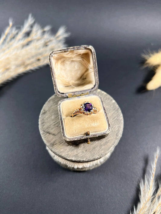 A yellow and white gold single stone amethyst ring, in a ring box