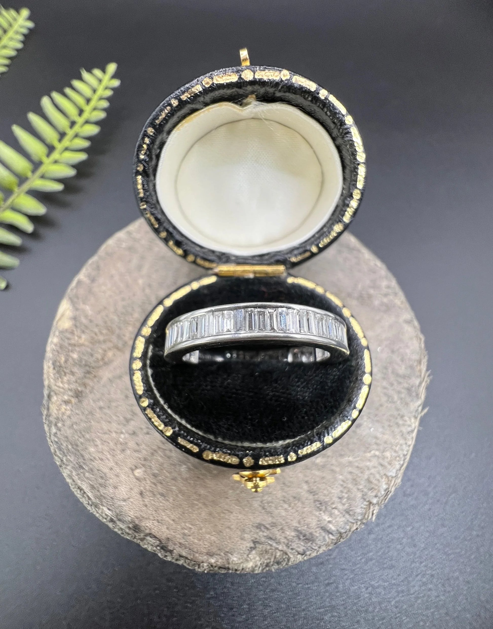 A white gold diamond full eternity band ring, in a black ring box