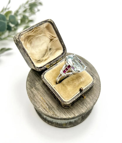 Vintage Cushion Cut Aquamarine Cocktail Ring with Ruby Shoulders in Platinum