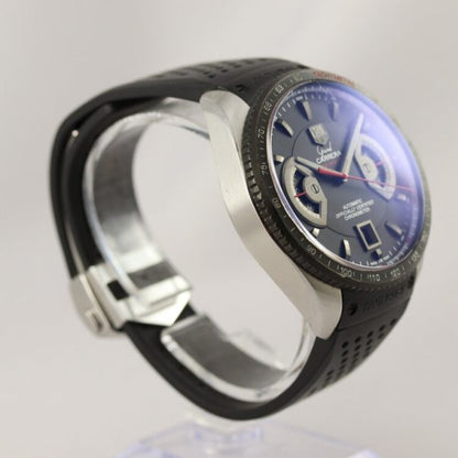 Tag Heuer Grand Carrera Calibre 17 Stainless Steel 44mm Automatic Chronograph Watch; black dial, screw-down buttons, luminescent hands, display back, on a black rubber strap with steel fold-over clasp. In mint condition and comes with box and papers, Circa 2011