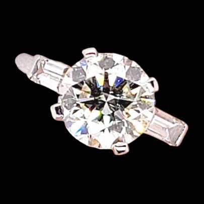 Vintage 2.54ct Diamond Solitaire Engagement Ring with Baguette Shoulders, single stone certified diamond flanked by baguette diamonds in platinum. Circa 1950s