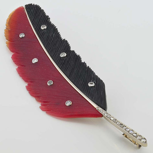 Art Deco Paltscho Vienna Red Chalcedony Black Onyx and Diamond Feather Brooch, carved red chalcedony and black onyx feather with diamond dots and rose-cut diamonds along the stem in 14ct white gold. Circa 1920. With Austro Hungarian marks of the period - Signed Ges. Gesh. (copyright) E. PALTSCHO – WIEN – KARLSBAD N. 29