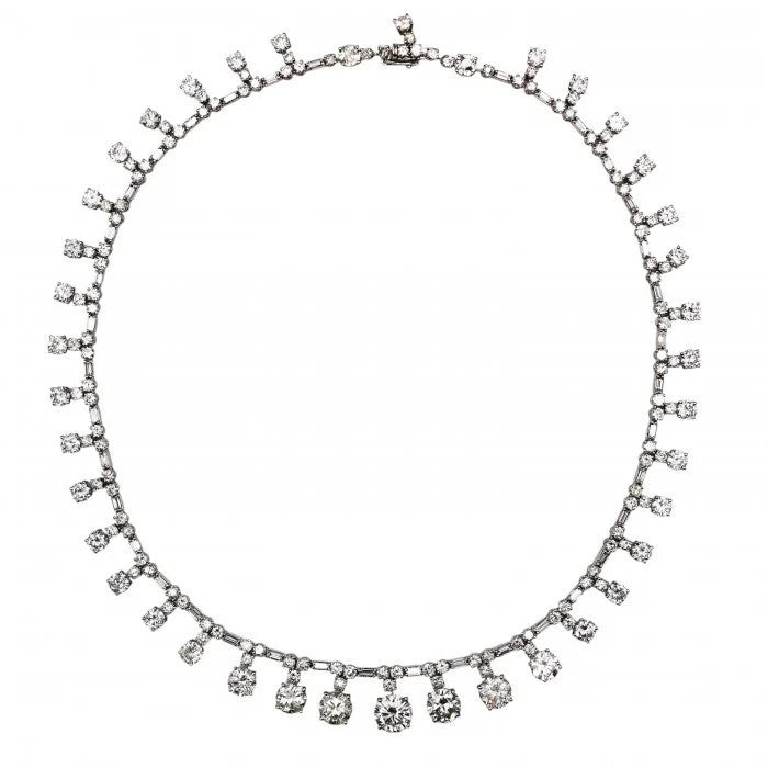 Vintage French Diamond Riviere Necklace in Platinum, 37.84 carats, graduating brilliant diamond drops on articulating chain of alternating pairs of round brilliant-cut diamonds, with baguette-cut diamonds. Circa 1950s